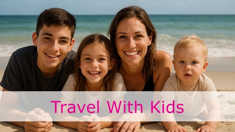 Mom posing with 3 kids with the beach in the background